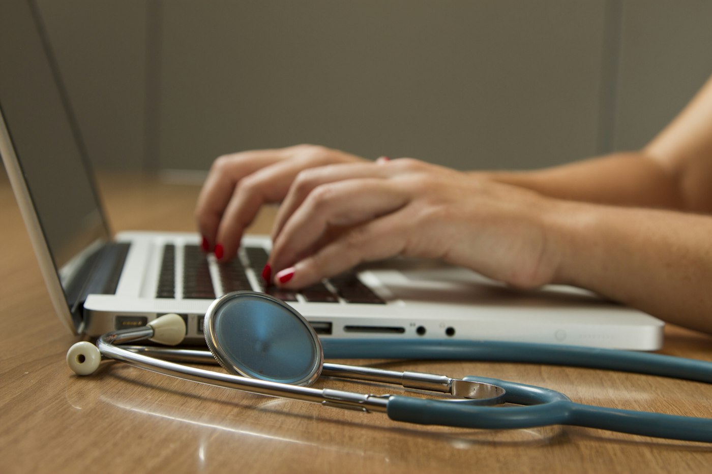Clinician reviewing notes with a patient nearby