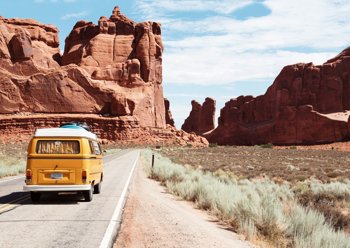 A road trip landscape under a bright sky